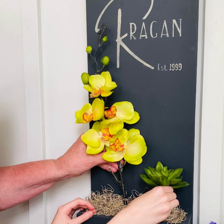 mom and daughter replacing Entry Envy Refill Kit with new summer month of orchid subscription decor
