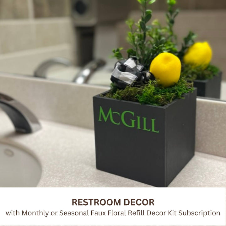 Corporate Envy shown in black with custom logo for corporate restroom branding available with monthly or quarterly faux floral subscription refill decor kits