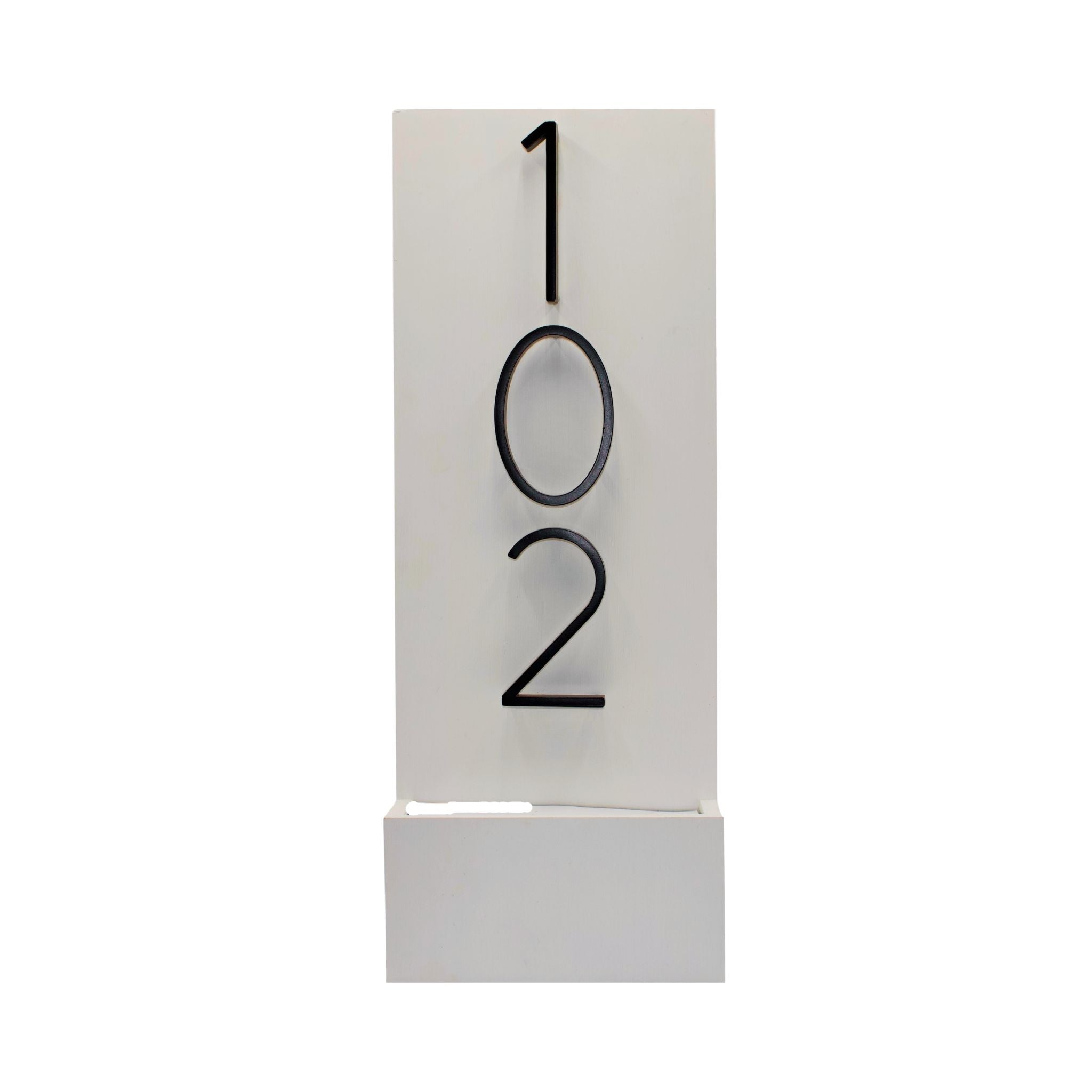 White vertical modern house number sign featuring raised black numbers 102.
