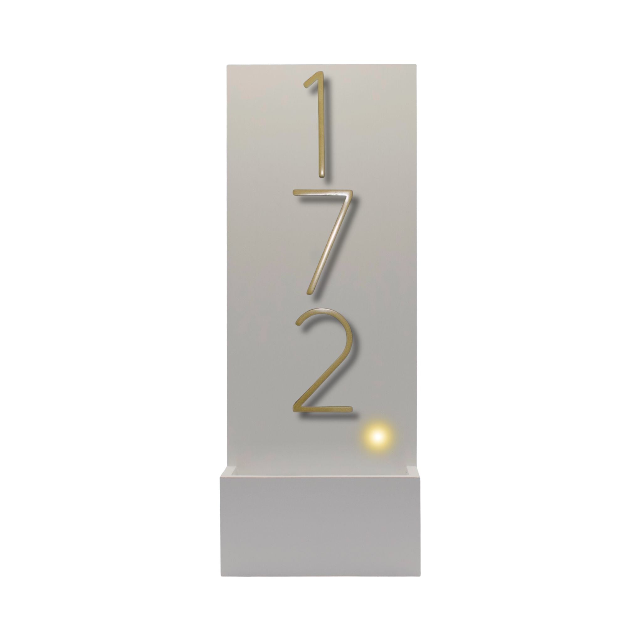 White vertical modern house number sign featuring raised modern gold numbers 172.