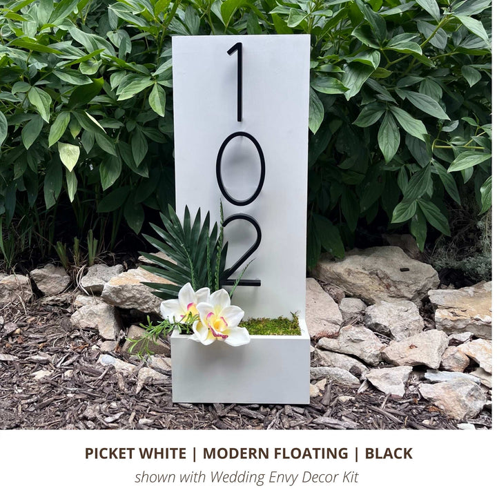 White vertical custom house number sign with black modern floating house numbers and Envy Modern Refill Decor Kit for Easter
