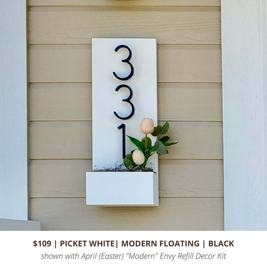 White vertical custom house number sign with black modern floating house numbers and Envy Modern Refill Decor Kit for Easter