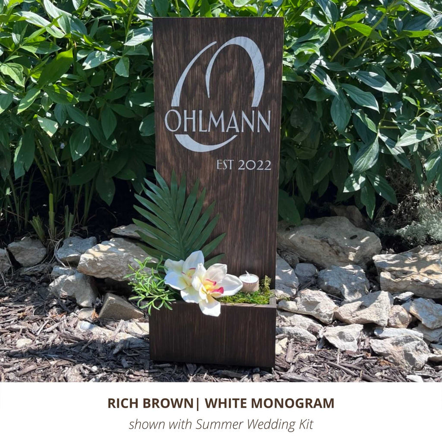 Rich brown exterior custom sign with personalize white monogram